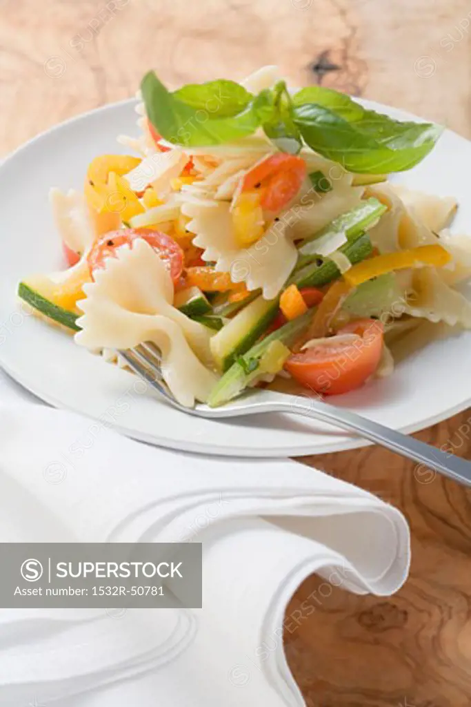 Farfalle primavera with vegetables and basil