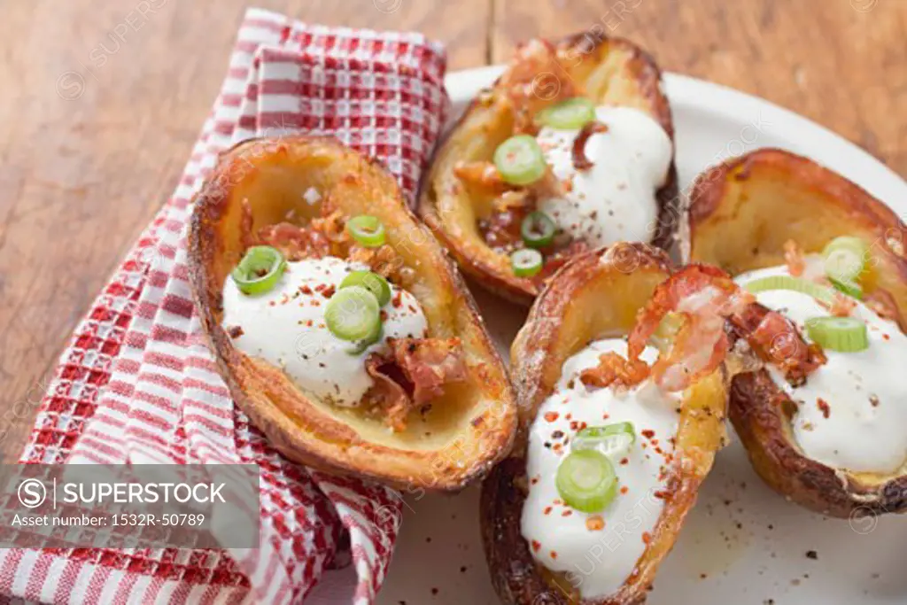 Baked potato skins with bacon and sour cream