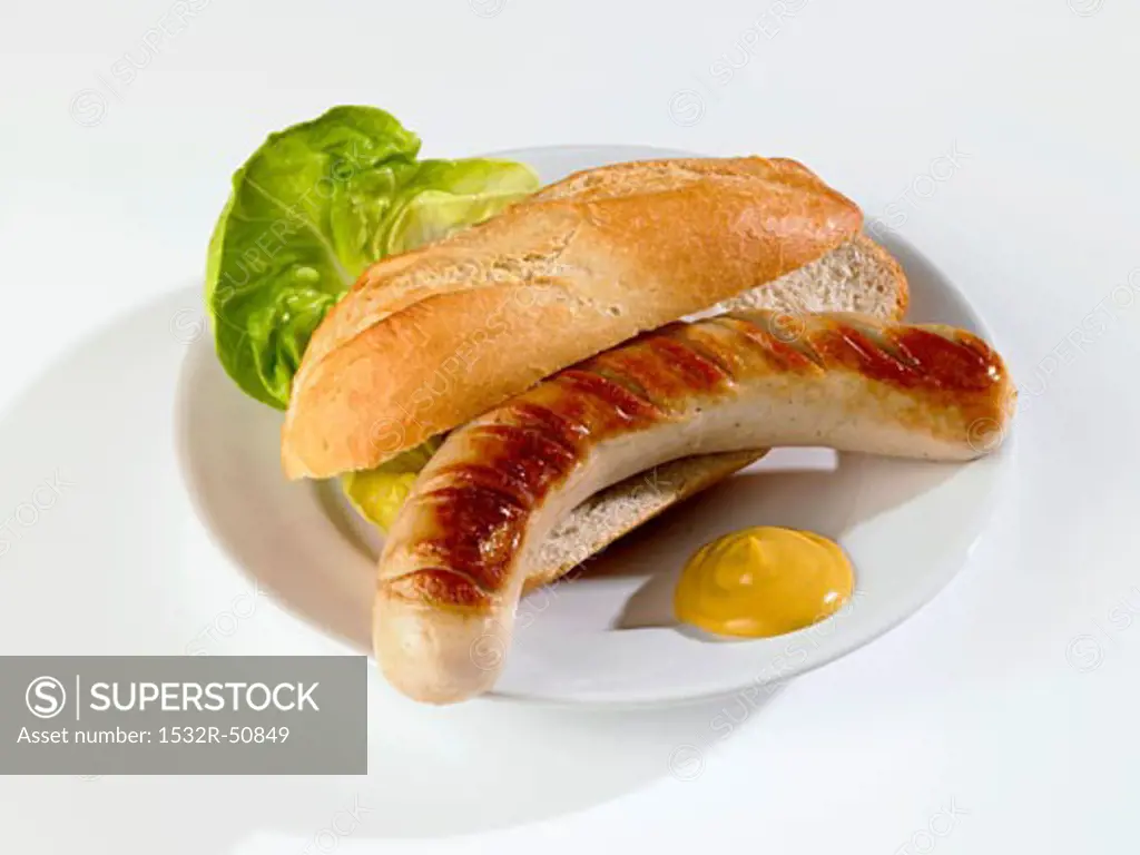 Grilled sausage in bread roll with mustard