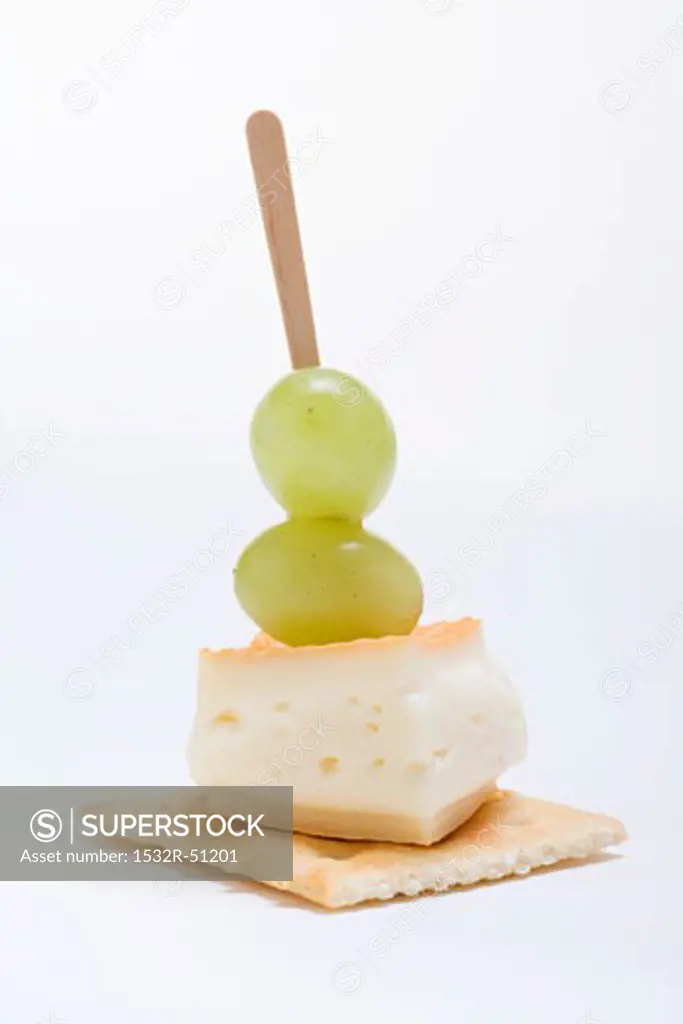 Washed-rind cheese and grapes on cracker