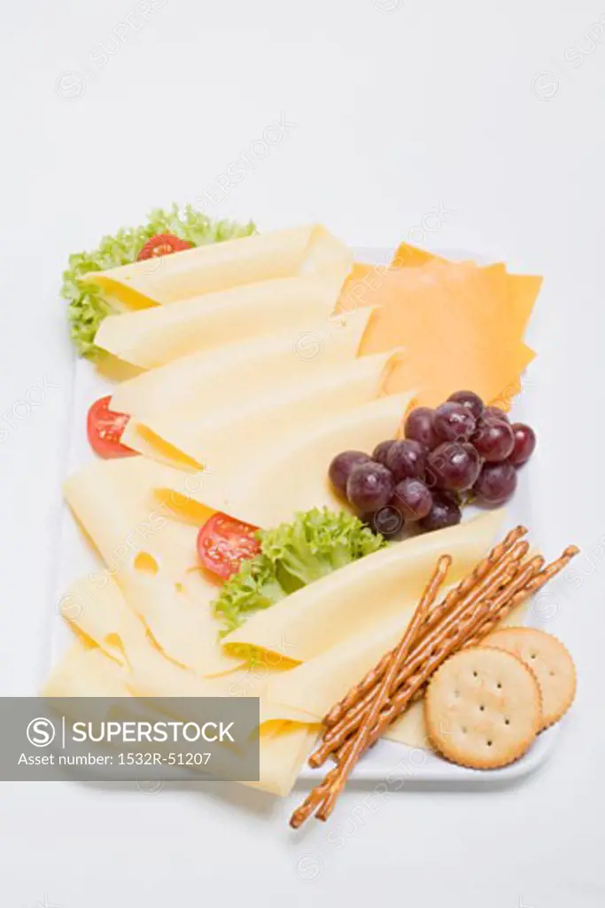 Cheese platter with grapes and nibbles
