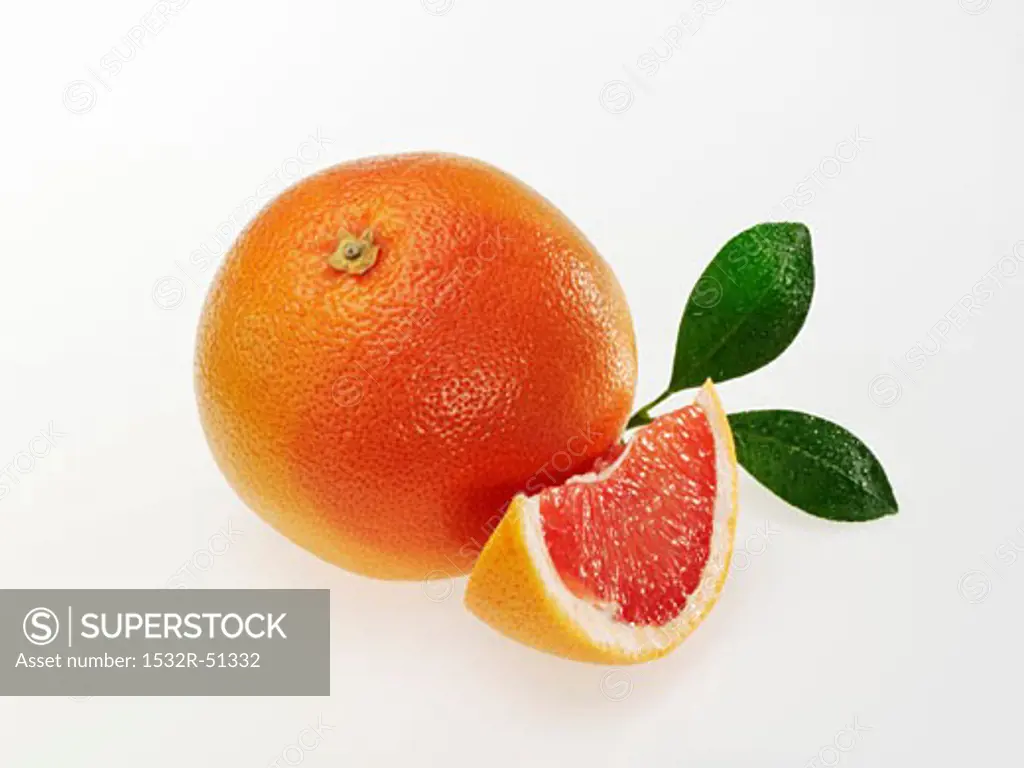 Pink grapefruit with leaves