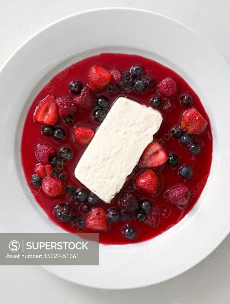 White chocolate mousse with berry sauce (overhead view)