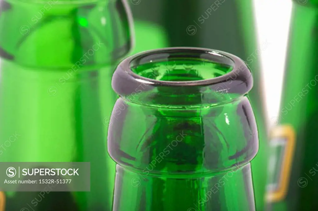 Green beer bottle necks (close-up)