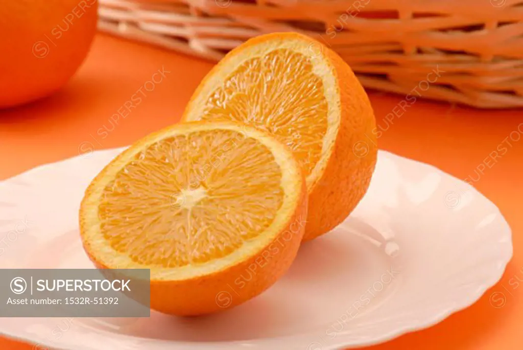 Two orange halves on plate