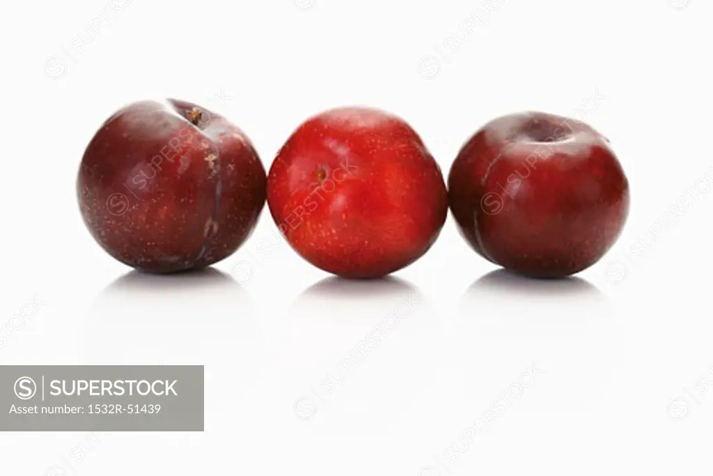 Three red plums