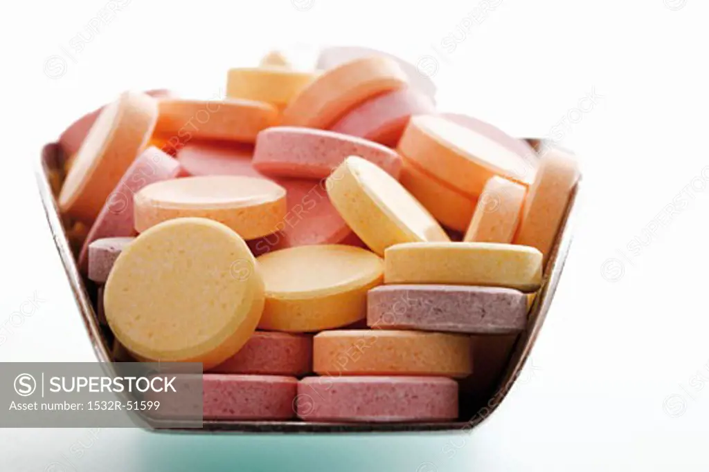 Coloured glucose tablets in scoop