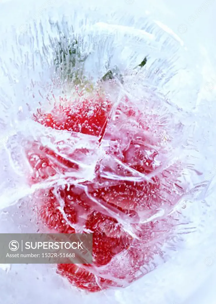 Strawberry in block of ice (close-up)