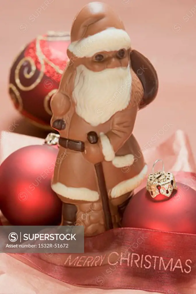 Chocolate Father Christmas, red Christmas bauble