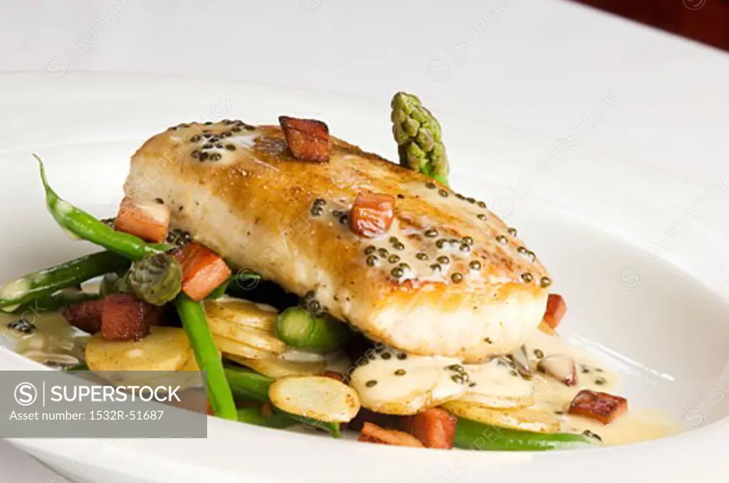 Salmon Steak with Caper Sauce on Potatoes, Beans and Asparagus