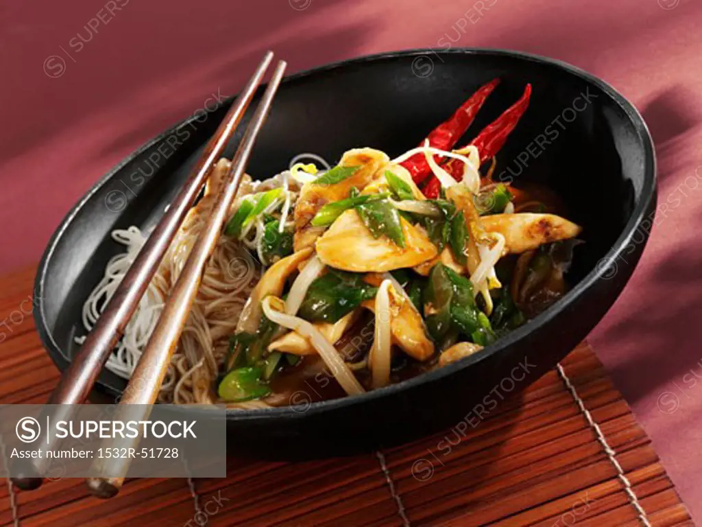 Chicken and noodles in wok