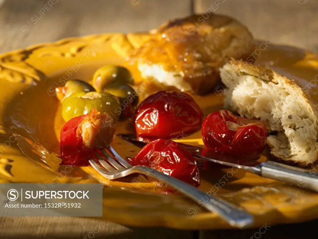 Red Peppers with Bread on a Plate with Fork and Knife