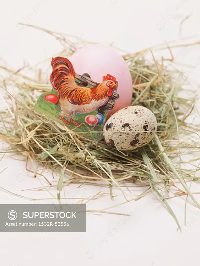 Easter egg and quail's egg in Easter nest