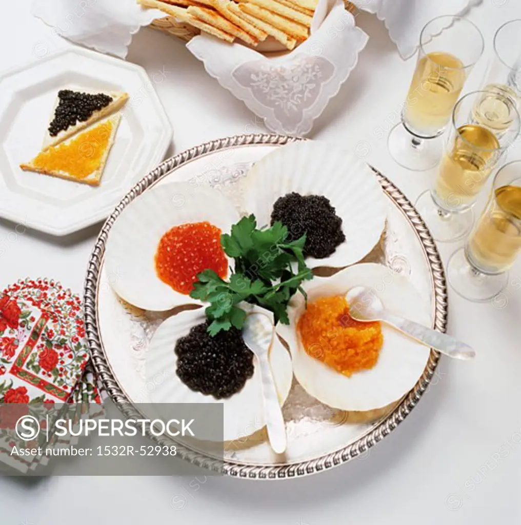 Assorted Caviar on Ice with Crackers and Champagne