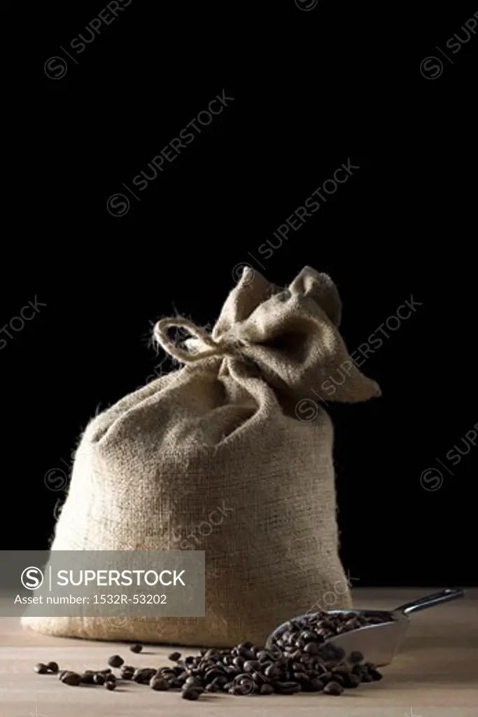 Sack of coffee beans with coffee beans in scoop
