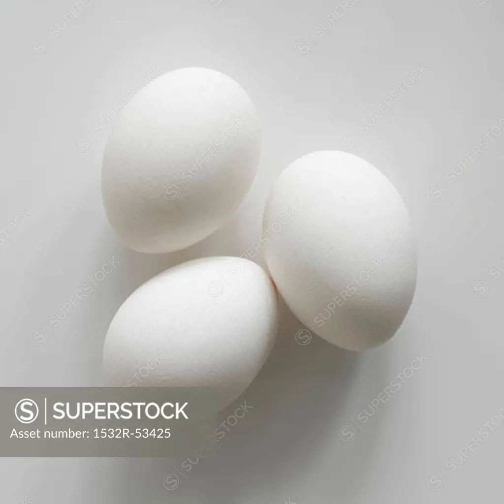 Three white eggs from above