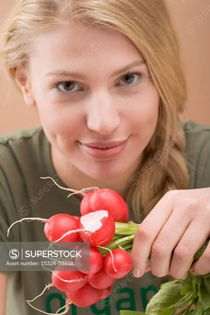 Woman holding radishes