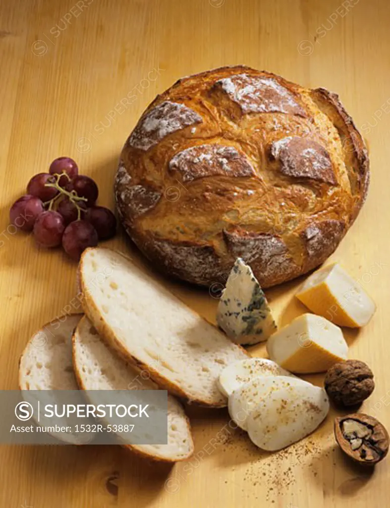 Bread, cheese, walnut and grapes