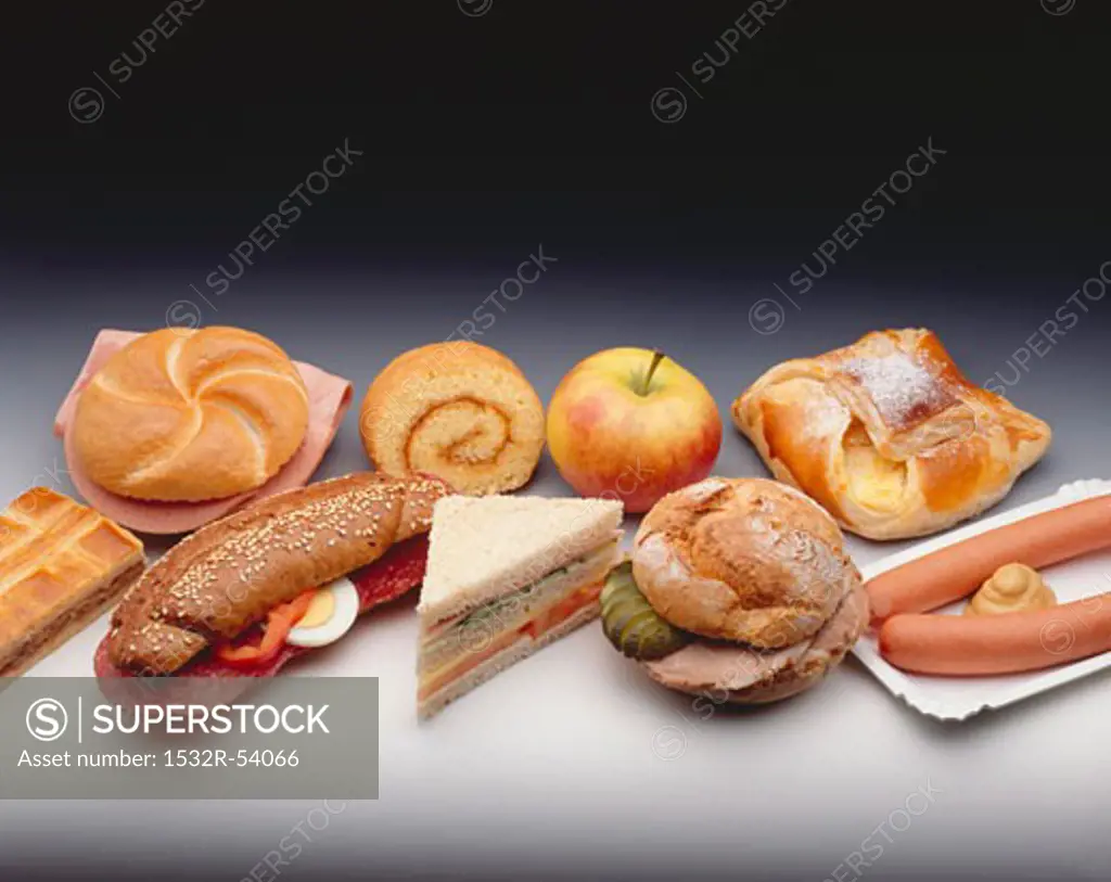 Assorted snacks, baked goods, filled rolls and sausages