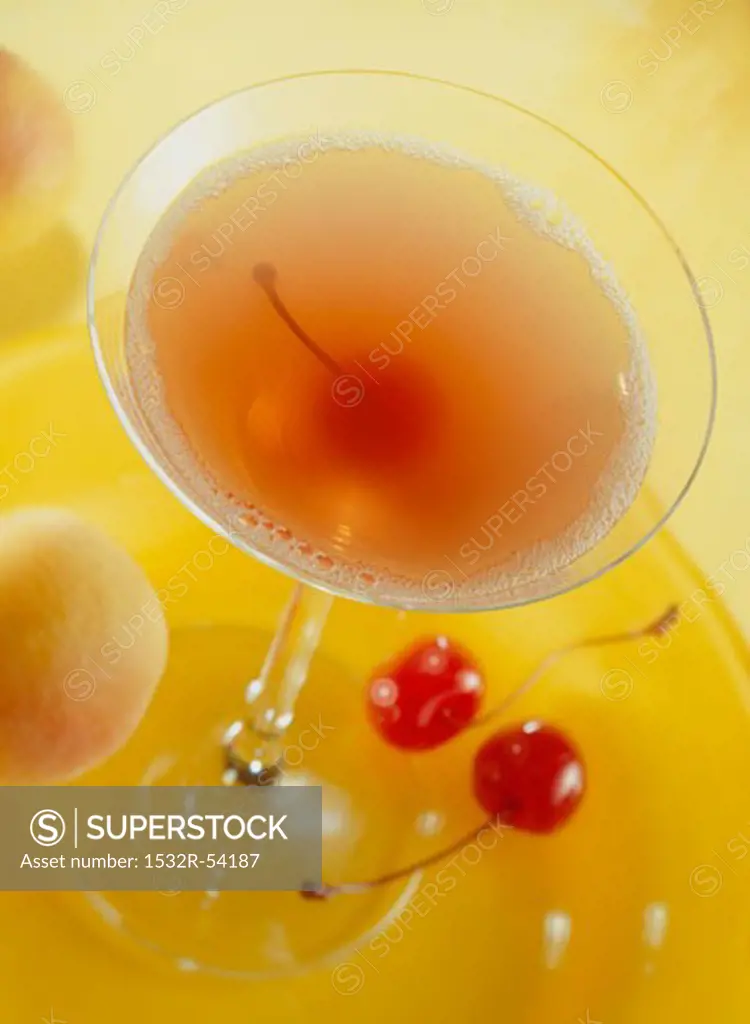 A Manhattan with cocktail cherry