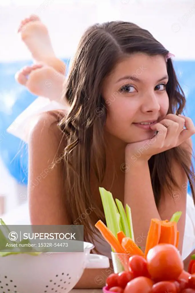 Girl with fresh vegetables