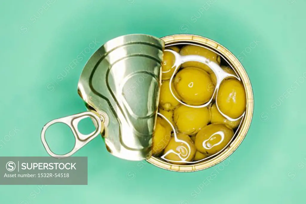 Opened tin of olives in oil