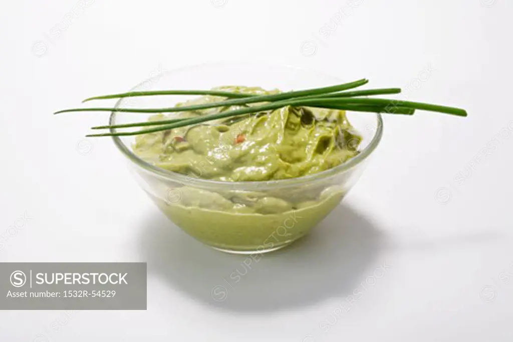 Guacamole in a dish with chives