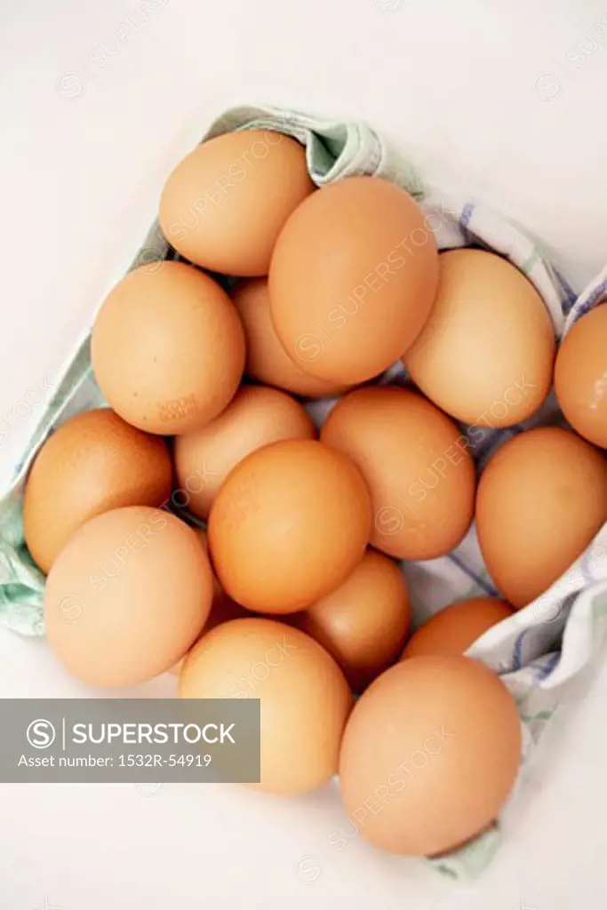 Organic eggs on a kitchen towel