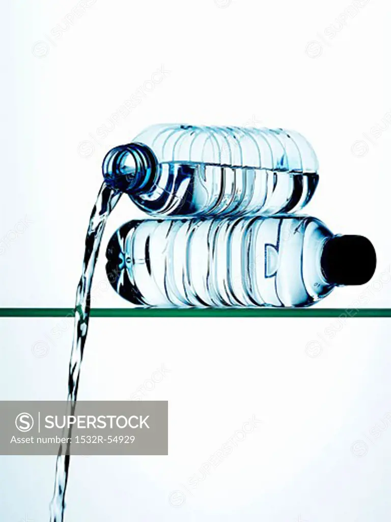 Water running out of a plastic bottle