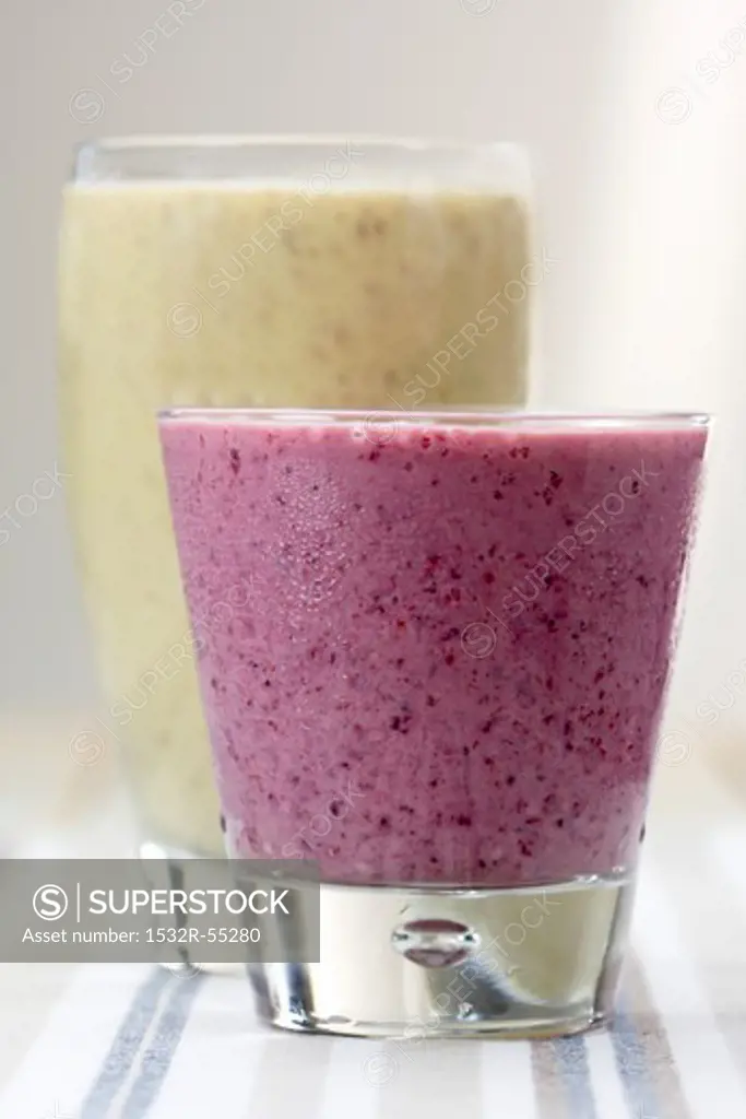 Peanut butter and banana smoothie and a berry smoothie
