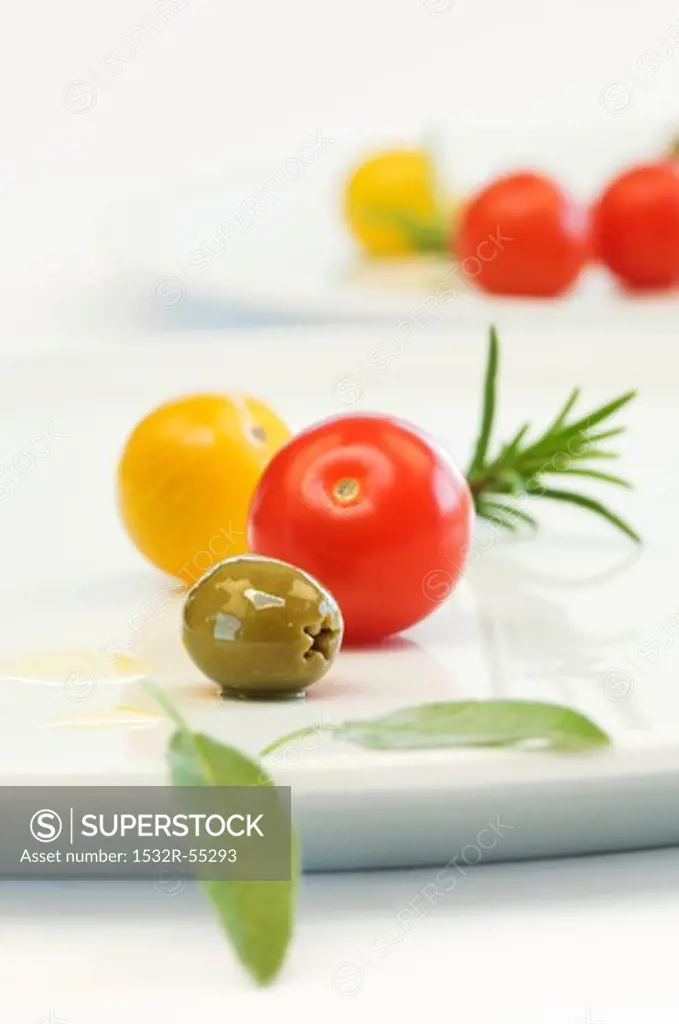 Cherry tomatoes, olives, sage and rosemary