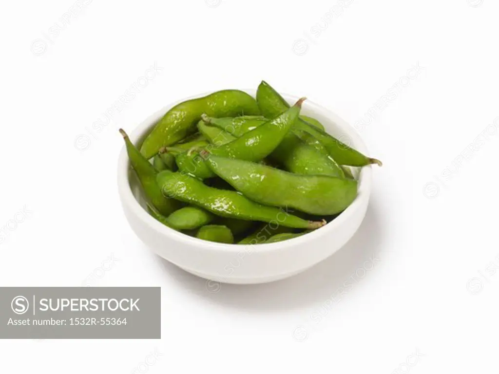 A bowl of cooked soya bean pods