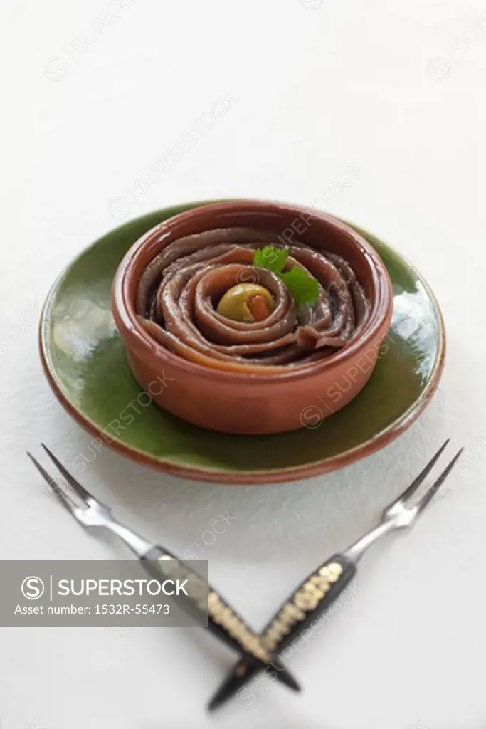 Sardine fillets in a terracotta bowl
