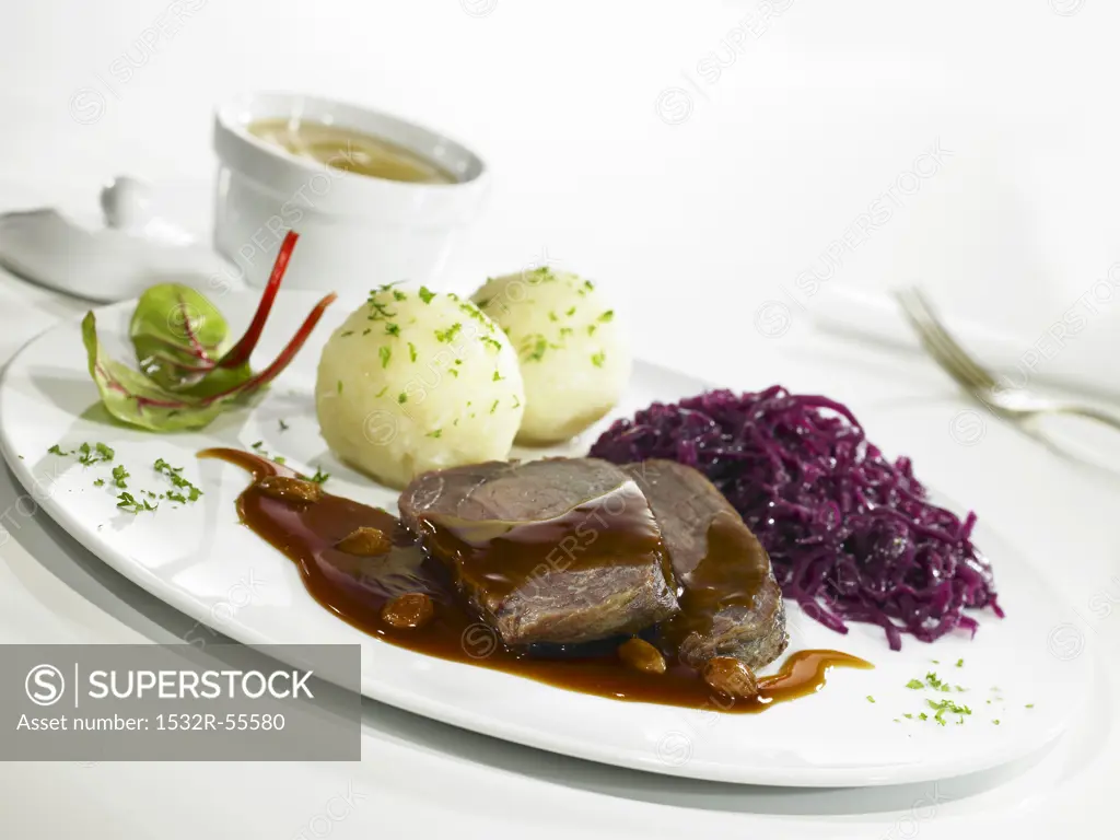 Sauerbraten (braised beef in vinegar) with red cabbage and potato dumplings