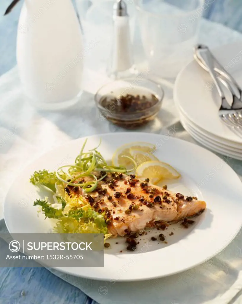 Butterflied salmon fillet with juniper berries and pepper
