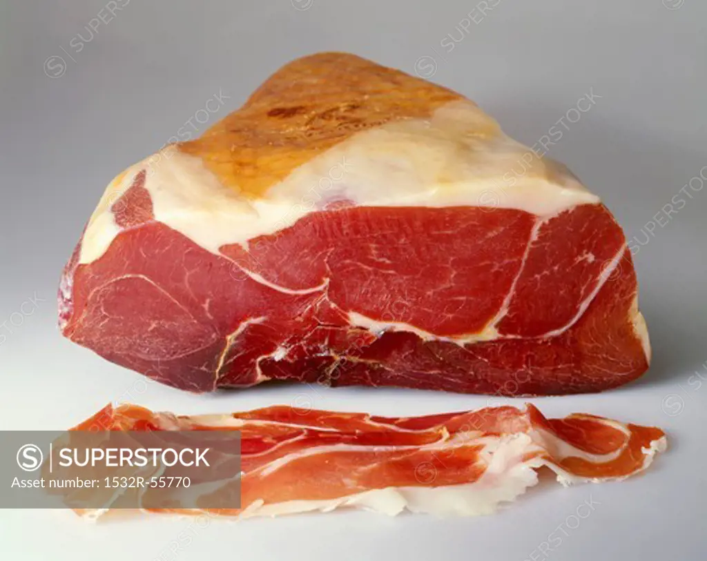 Parma ham on the joint and sliced