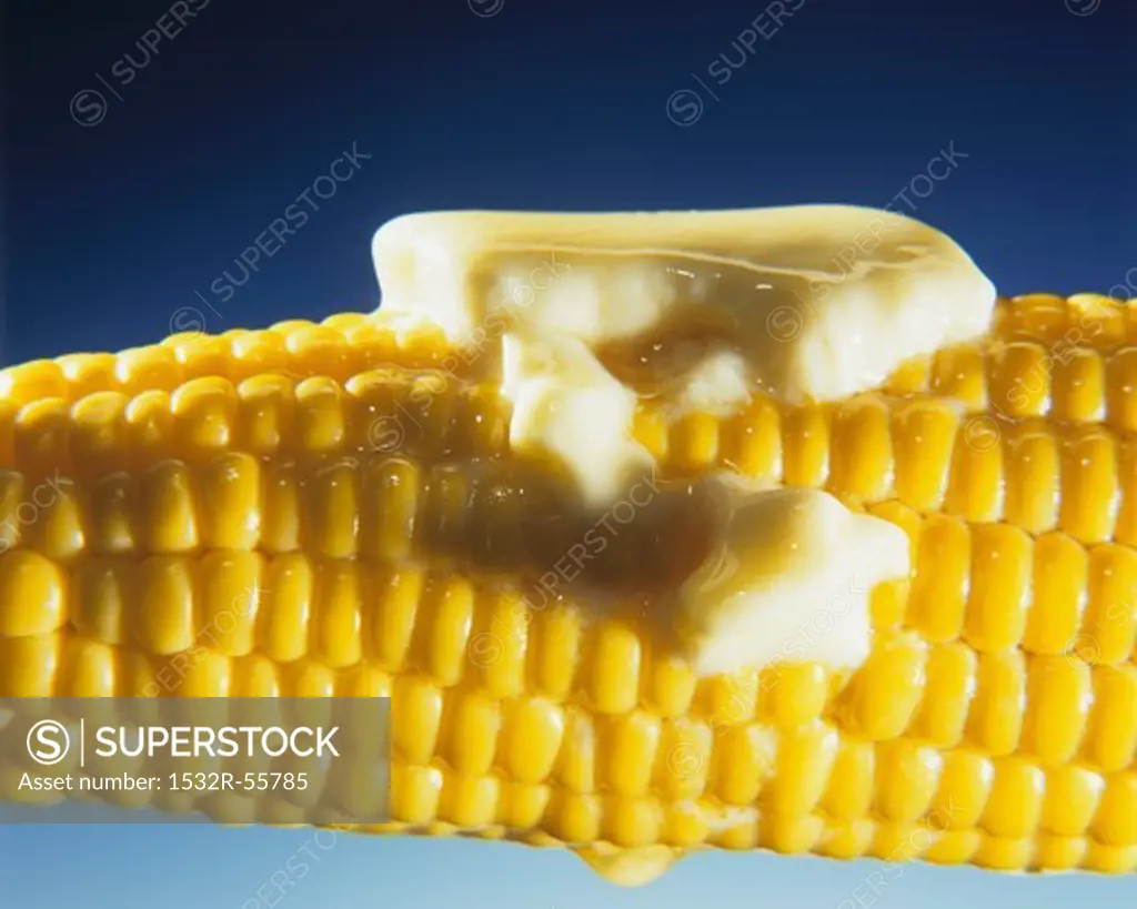 Cooked corn on the cob with melting butter