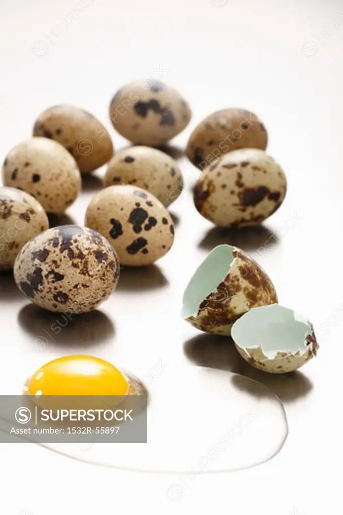 Several quails' eggs, one broken