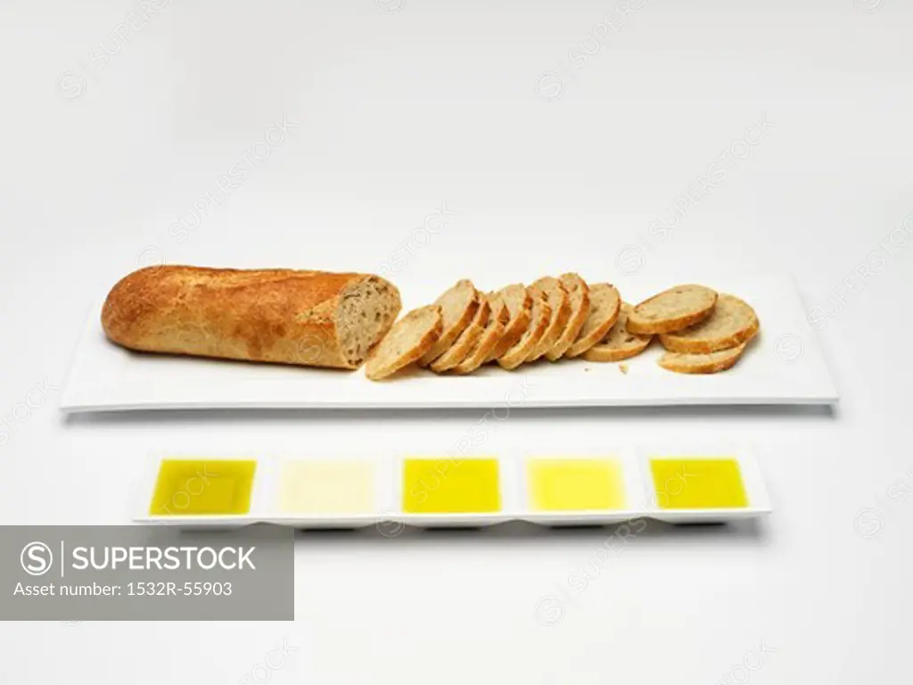 Baguette and various types of olive oil for tasting