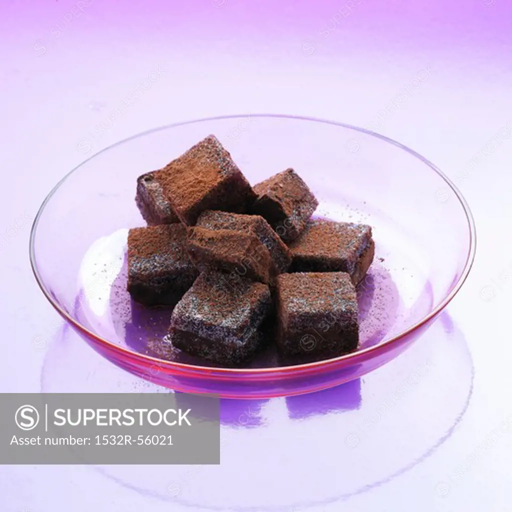 Black Currant Truffle Squares in a Glass Dish