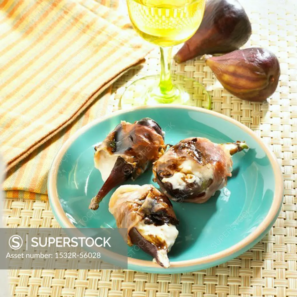 Grilled Figs Wrapped in Prosciutto with Mascarpone Cheese; Blue Plate