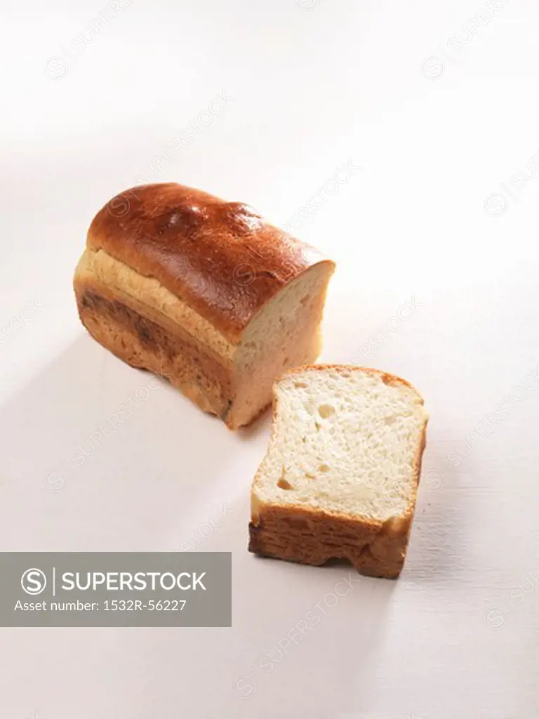 A loaf of white bread, sliced