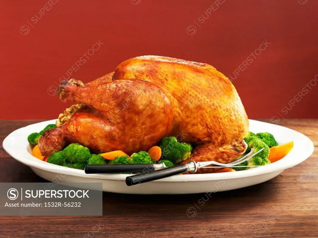 Roasted stuffed turkey with vegetables