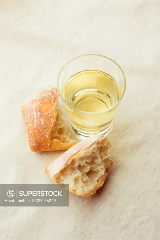 Glass of White Wine with Crusty Roll