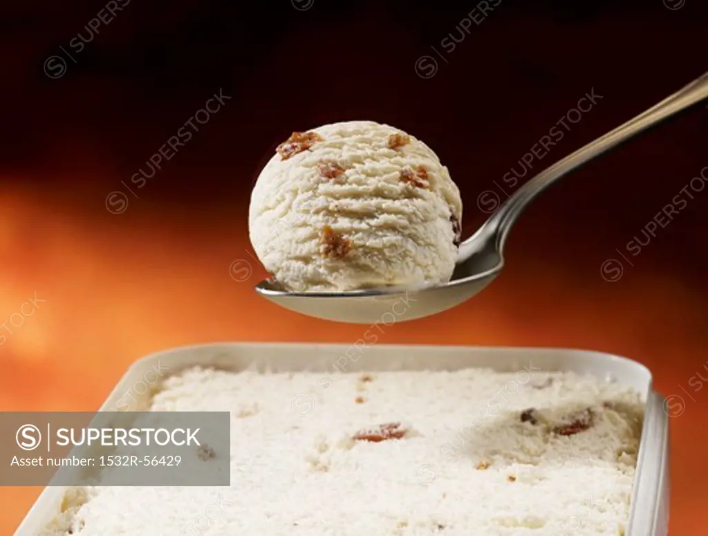 A scoop of walnut ice cream on a spoon