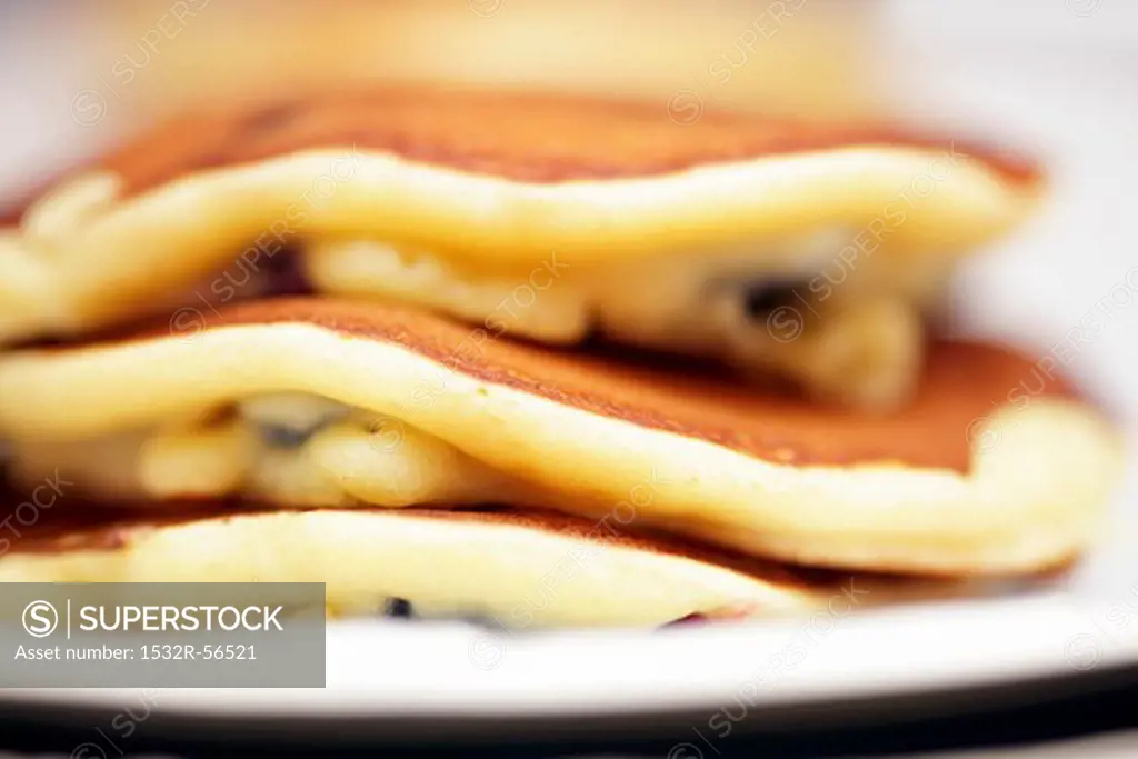 A stack of blueberry pancakes