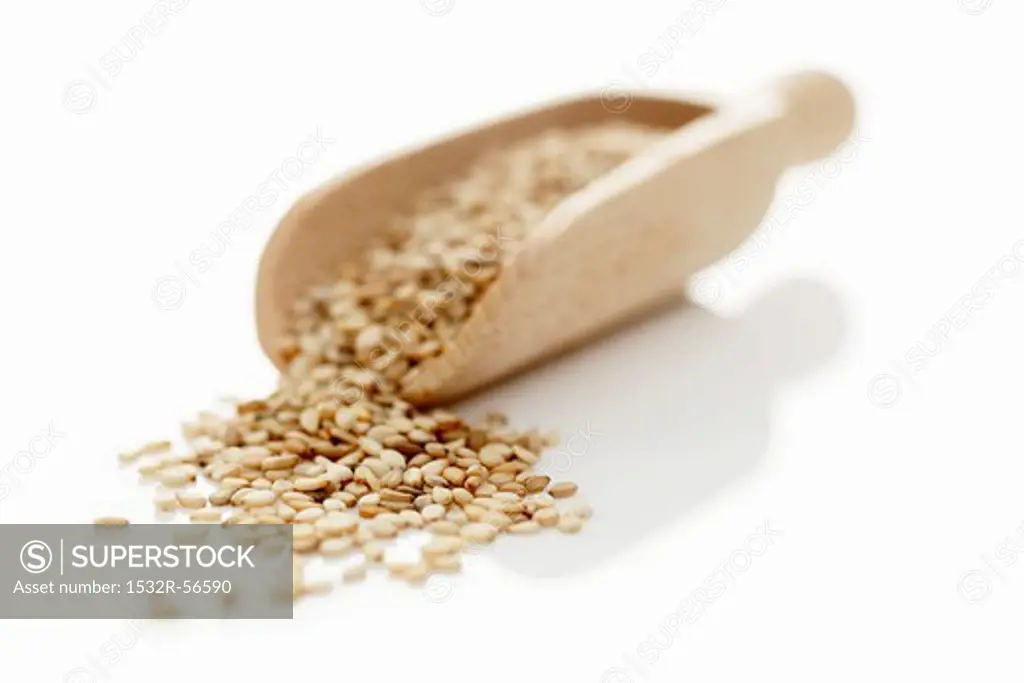 Sesame seeds in a wooden scoop