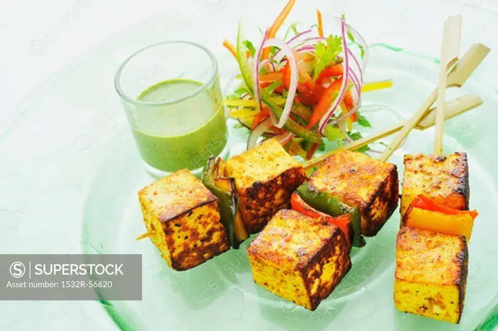 Paneer tikka (Indian cheese dish) with a mint dip