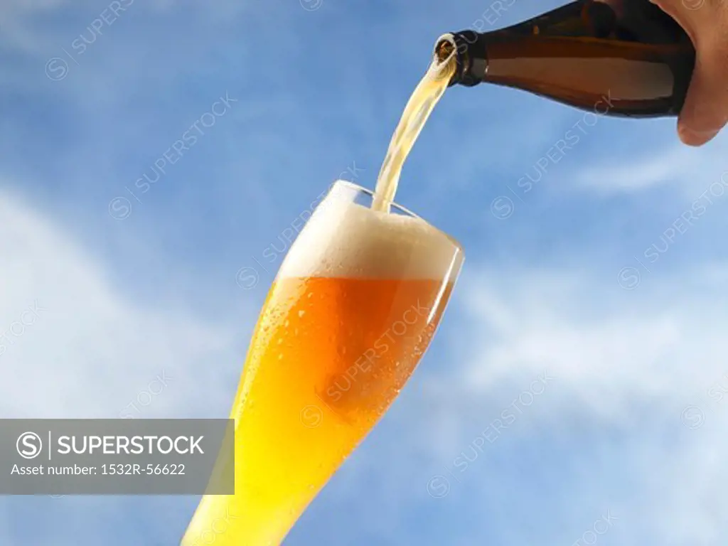A wheat beer being poured