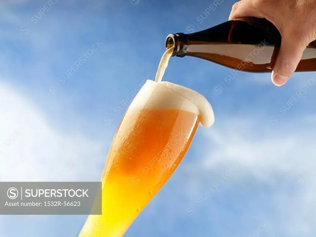 A wheat beer being poured